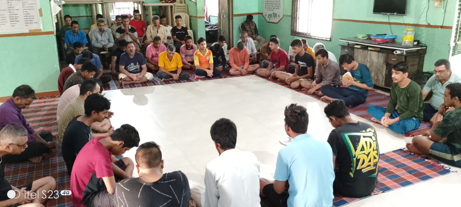 Residents sitting in circle during morning prayer and mindfulness meditation