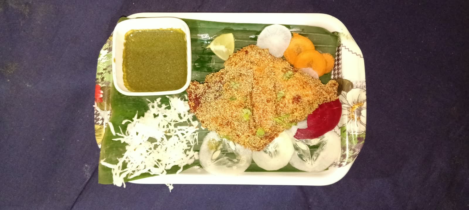 Freshly prepared wholesome meal tray with salad and chutney at Happy Life Social Foundation